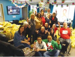 The staff and volunteers of the Ottawa AIDS Committee gathered together at Christmastime to prepare the many Holiday Hampers of food that they distribute to their clients. Photo Supplied 
