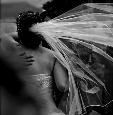 “I captured the veil in the breeze while attending this wedding. The veil is about motion, but the hand on her back is the emotion.” Photo by Peter Fowler
