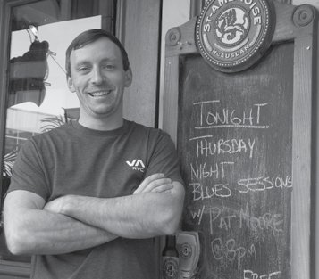Michael Eastabrooks, owner of Irene's Pub, thinks Greystone Village could help support a pub. Photo by John Dance