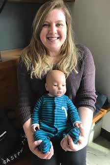 Jillian Budgell, who teaches the Parenting course at Immaculata, is pictured here with one of her 'babies'. Photo by Lori Gandy