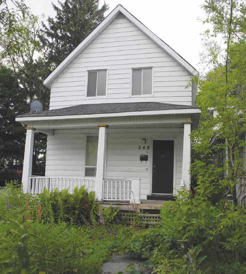 A new three-storey commercial and residential building will replace an old house at 248 Main Street, but the OOECA planning committee questions whether the front yard setback provision of the zoning has been respected. Photo by John Dance