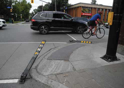 The “flex posts” at the southwest corner of Main and Hawthorne have again been destroyed but, when the intersection is reconstructed, permanent bollards may be installed to protect pedestrians from large vehicles running over the substandard sidewalk. Photo by John Dance