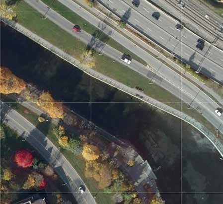 This aerial photo shows how poorly the Colonel By Drive side of the Rideau Canal (top) is treed compared to the Queen Elizabeth Driveway side. The NCC and MP Yasir Naqvi agree with the Old Ottawa East Community Association that more trees should be planted on the Colonel By side. Image by City of Ottawa