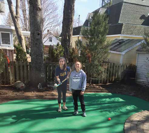 Sisters Abrie and Kenzie put their backyard turf practice patch to good use during the COVID pandemic.  Photo by Hannes Girgis