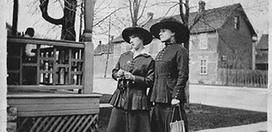 This photo, taken around 1910, pictures the author's grandmother, Eva Landry Villeneuve (L) and her great aunt, Delina Landry next to the family home on Main Street. Two trees are pictured directly behind them, but one had to be cut down at a later date probably because of limited space as they matured. Photo Supplied 