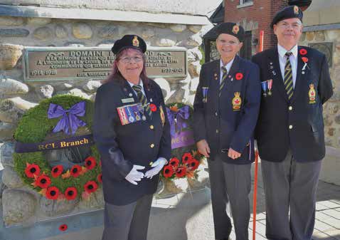 Legion members Wanda Riddell (left), Katherine Winters and Robin Brown laid one of the wreaths at the Brantwood Gates. Photo by John Dance 
