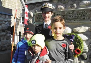 Commander Leah Friesen and her three sons Neil (left), Adrian, and Dylan placed a wreath for the military families of Old Ottawa East. Photo by John Dance 