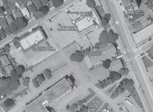 This aerial image of Echo Drive to Main Street south of Graham Avenue shows the extent of hard asphalt and concrete surfacing that creates runoff and possible flooding. Using permeable "sponge" materials instead is one of the ways that NBS can help to manage adverse climate change effects. Image by Google Maps